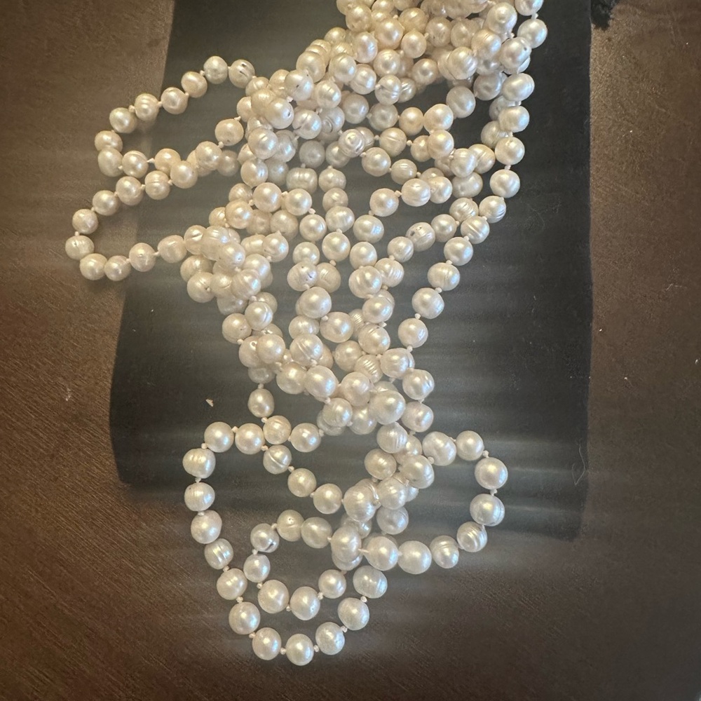 Gorgeous long strand of  vintage authentic genuine pearls.